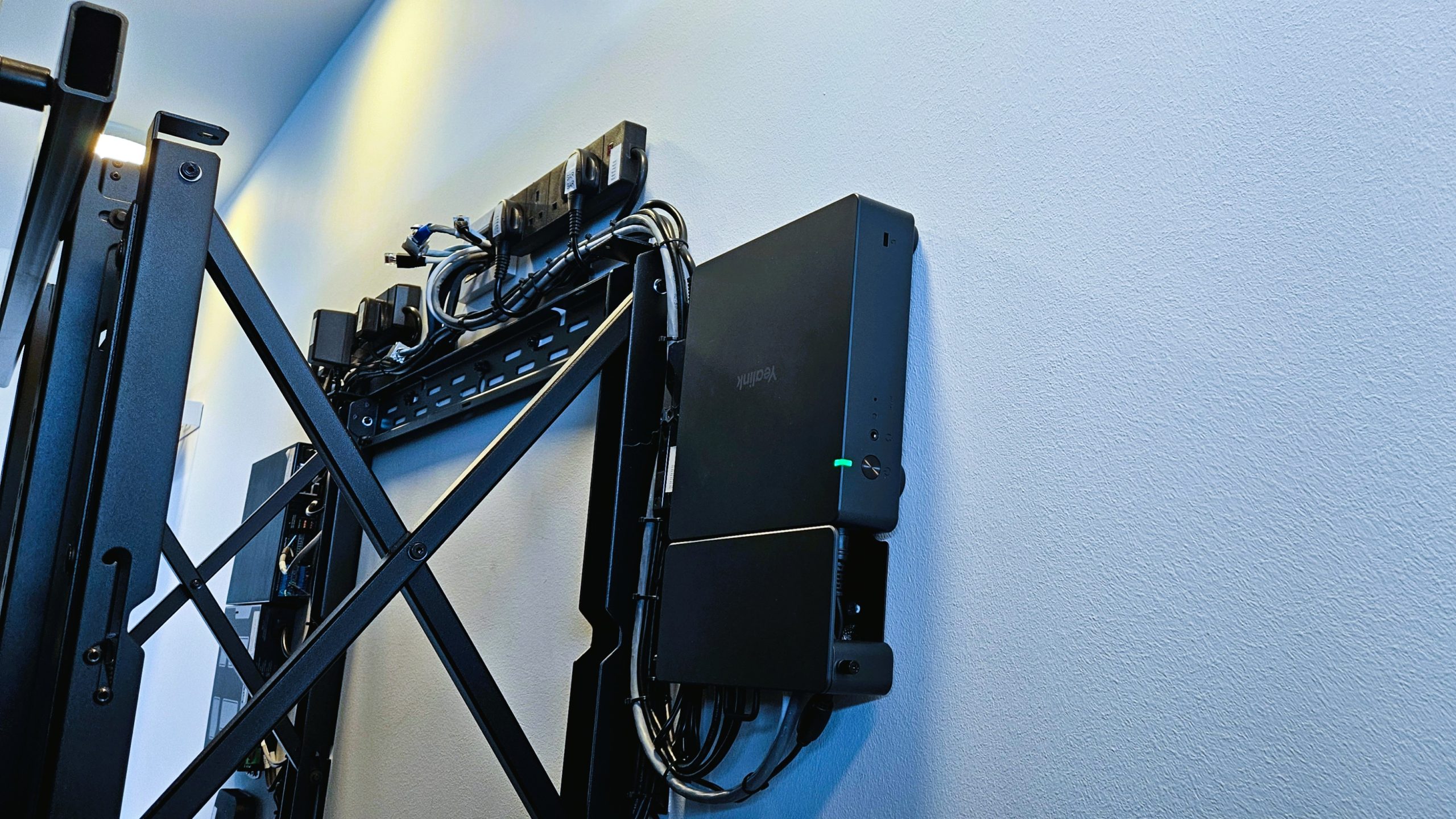 Accessible zoom compute module behind display to support service work in leadership collaboration room