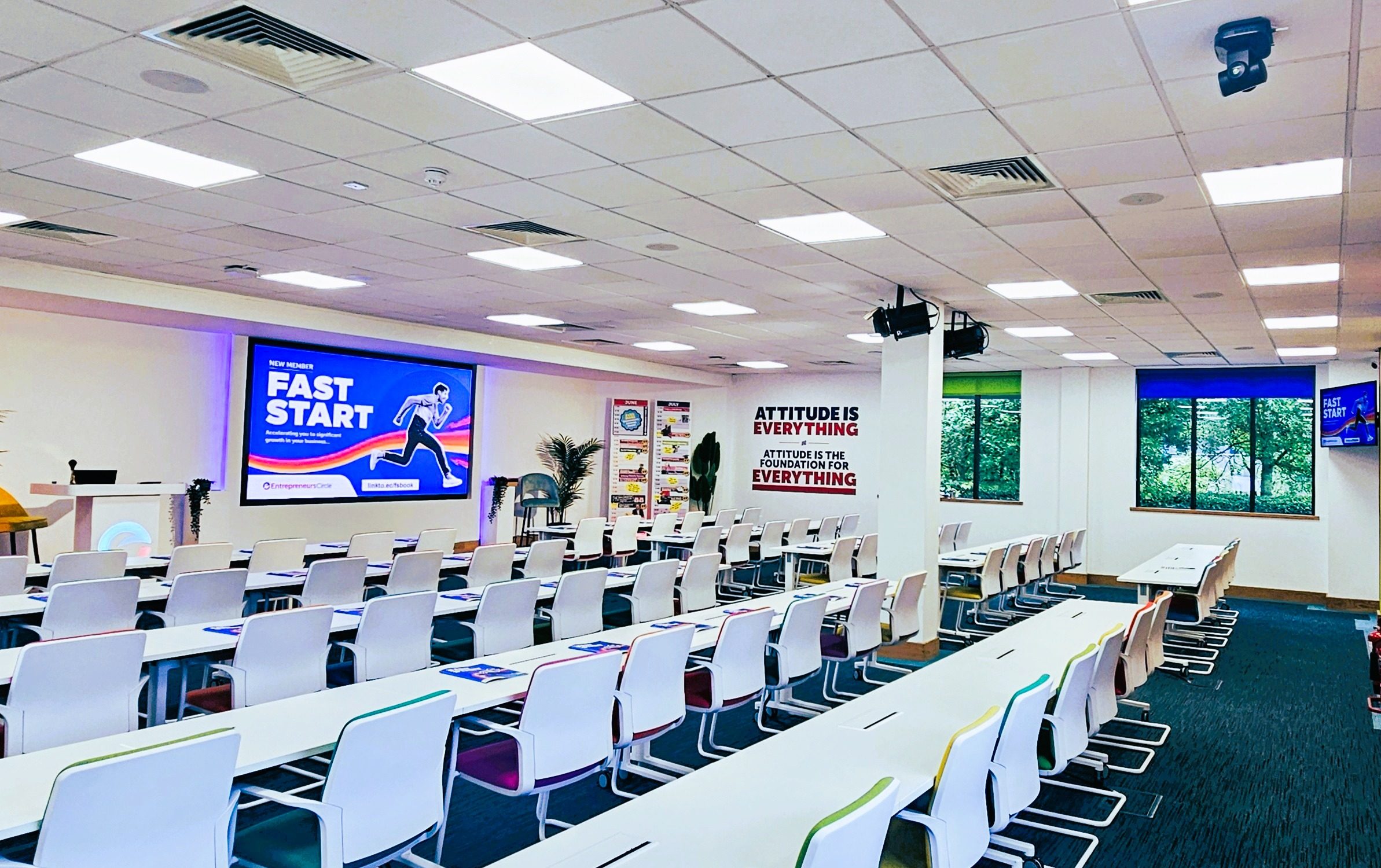 Large training room at Entrepreneurs Circle showing presentation content for live session